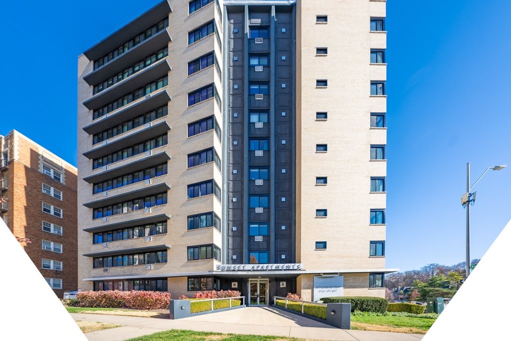 A tall building with a blue sky in the background.